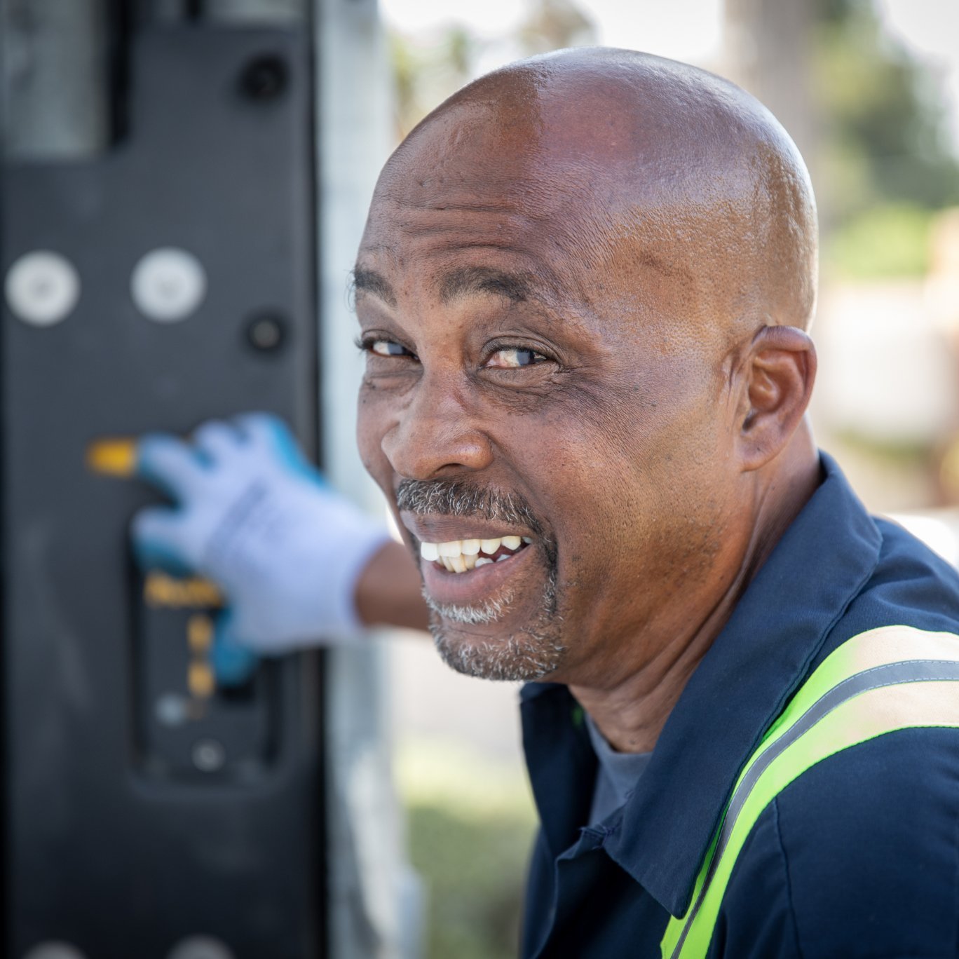 Man smiling while touching buttons of a truck