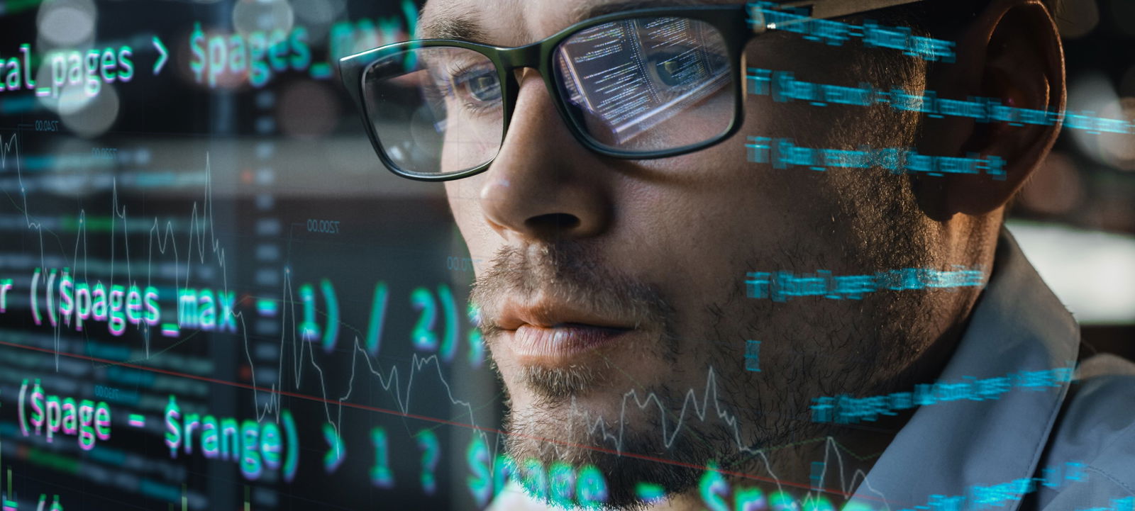 A man with glasses looks at the statistics on a transparent screen